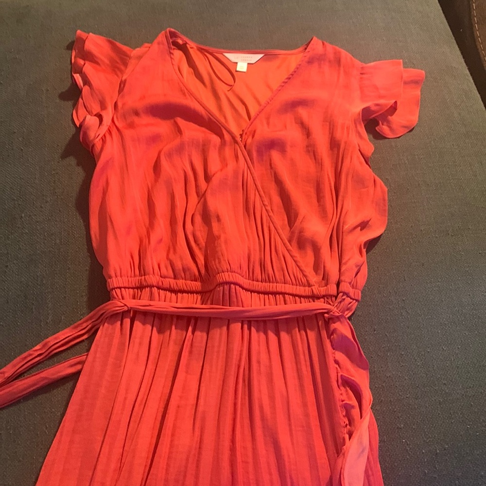 A beautiful dress, worn once.  Soft and beautiful! Orange/rust color.